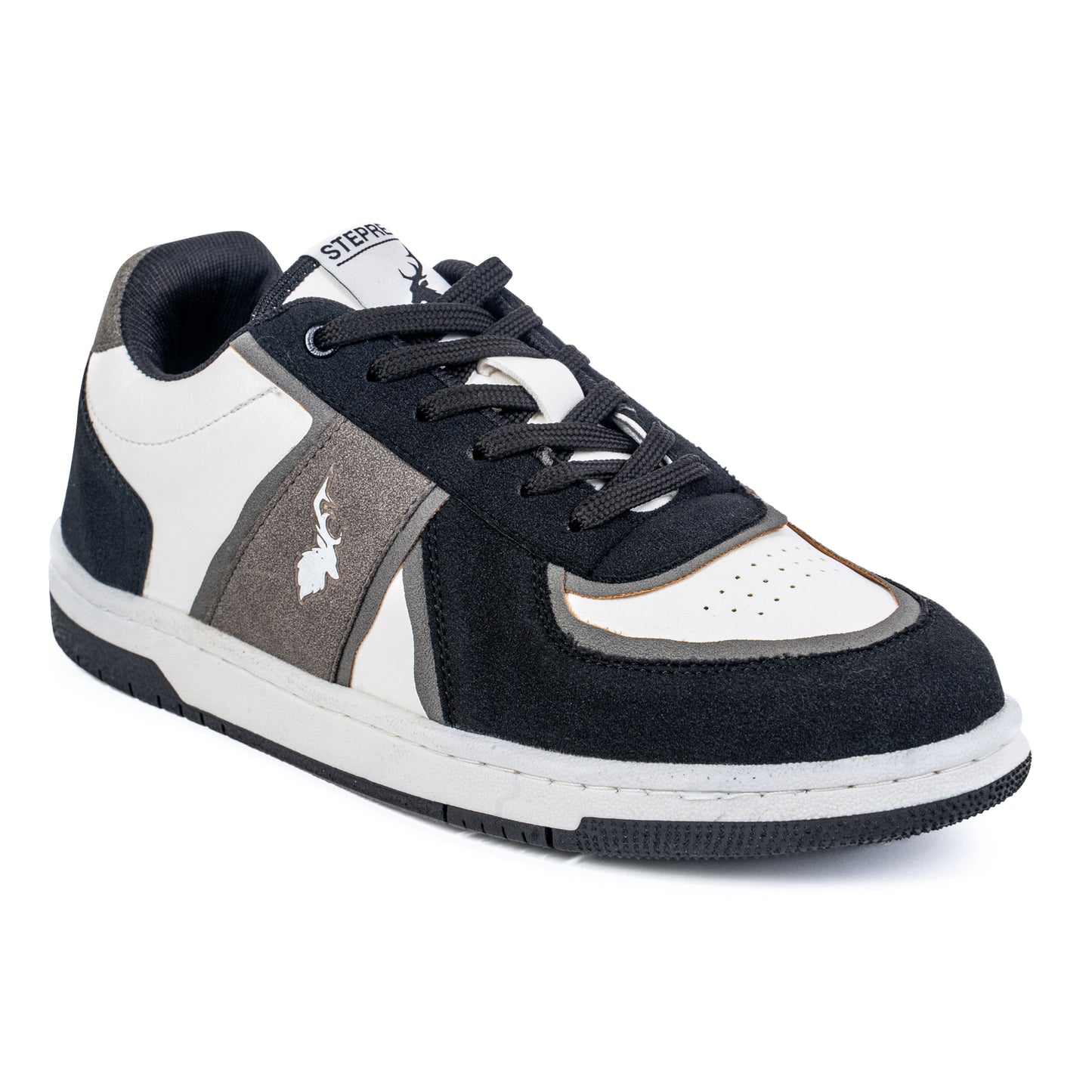 Angled rear shot of monochrome sneakers highlighting heel detailing, suede construction, and textured black sole