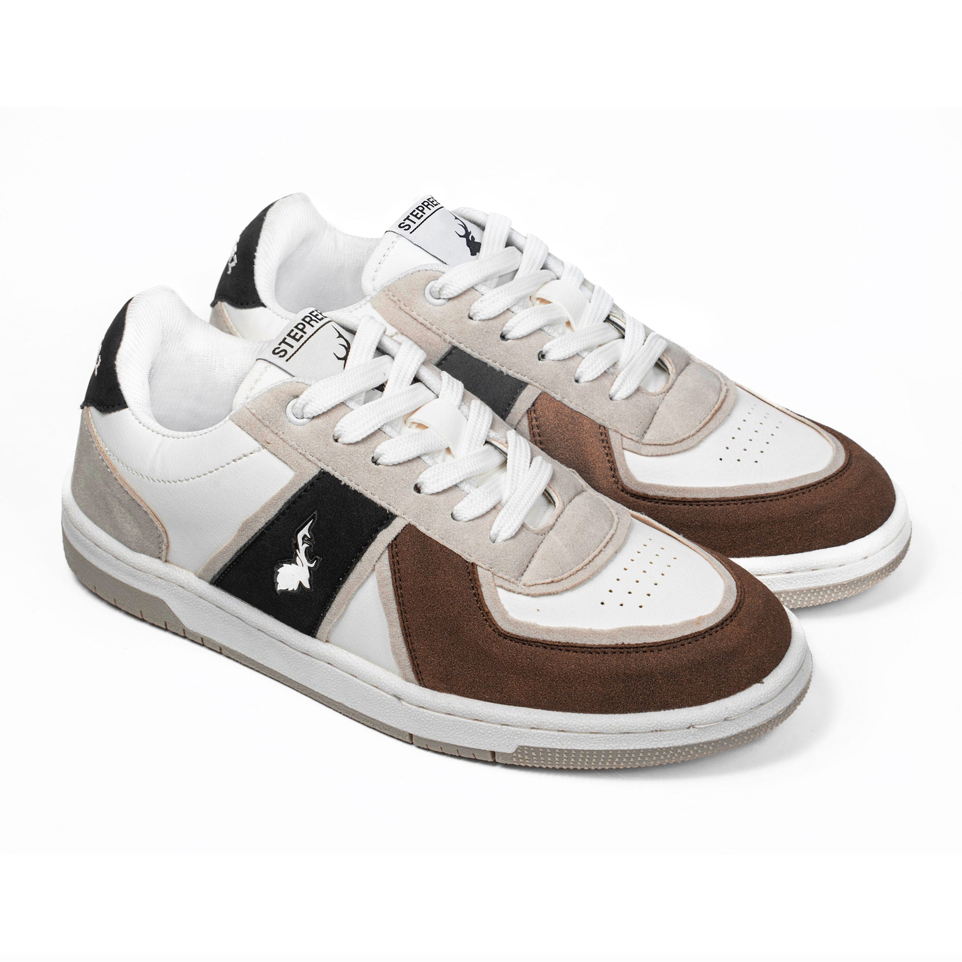 Brown, white, and black low-top casual sneakers with suede panels, lace-up front, and breathable perforated toe design