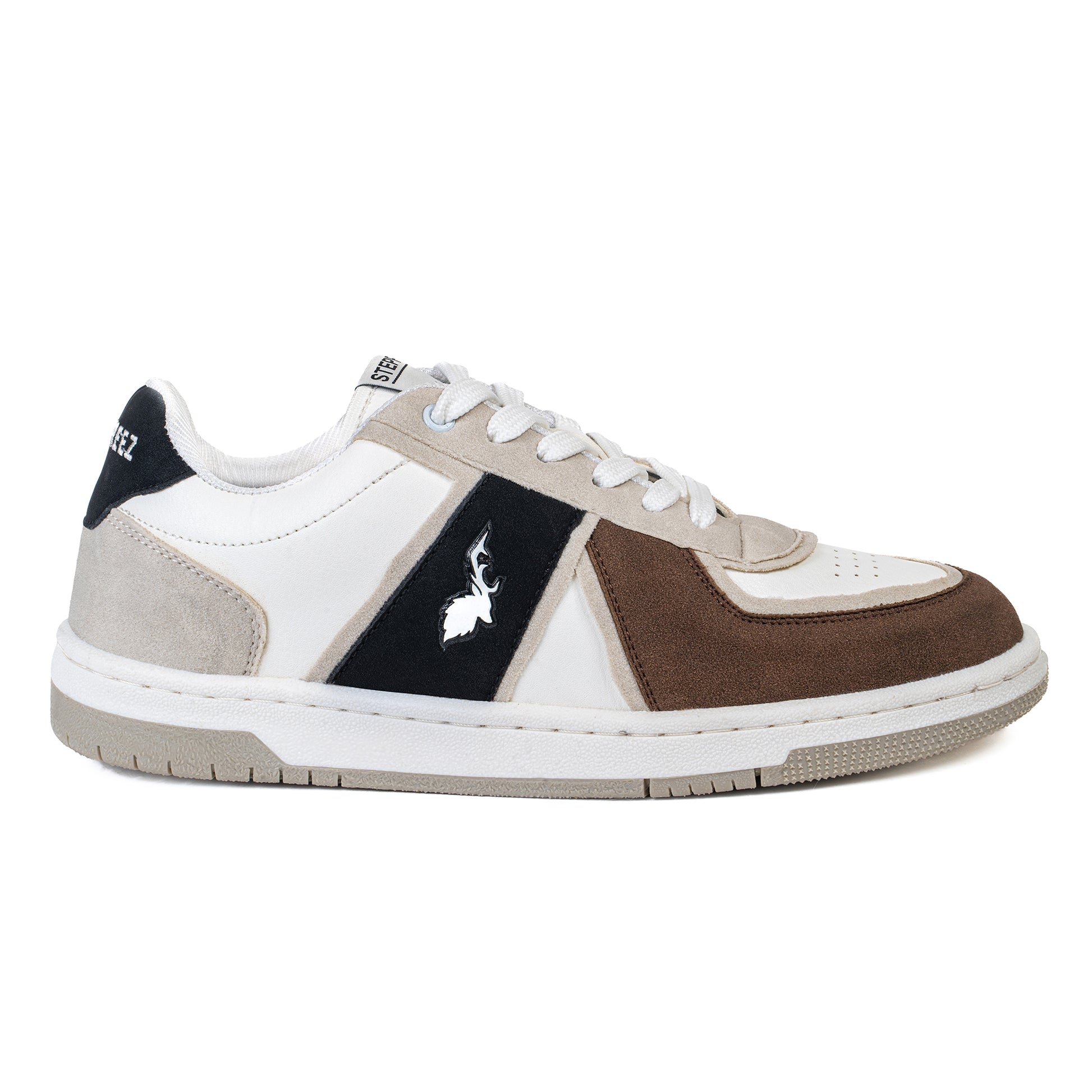 Stylish side view of casual sneakers featuring tri-color upper, contrast suede detailing, and a low-profile sole.