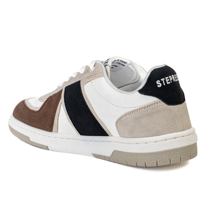 Rear angle of modern streetwear shoes with neutral tones, black suede panel, and cushioned sole