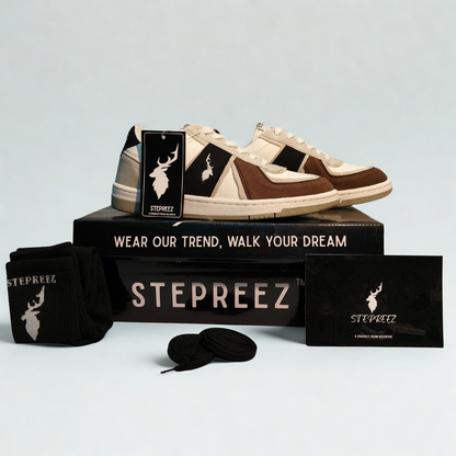 Complete unboxing view of brown,  black, stone-gray and white casual sneakers with branded box, socks, and extra laces.
