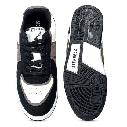 Top and sole view of Monochrome sneakers,  showcasing rubber grip outsole, cushioned insole, and classic lace-up build